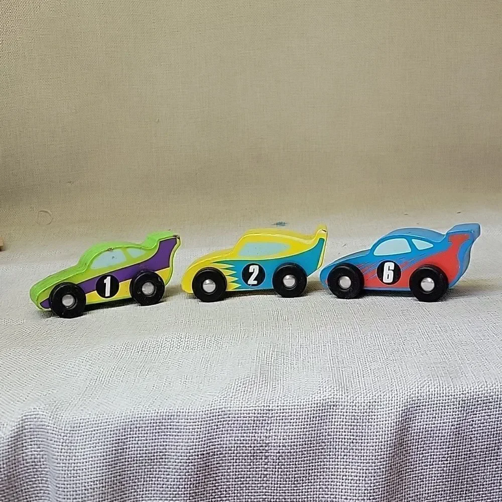 Assorted small wood‎ vehicles..train, dumo truck, race cars...